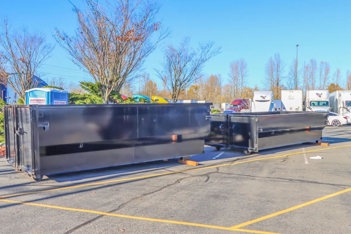 Professional dumpster rental service with roll-off container on residential driveway in North Charleston